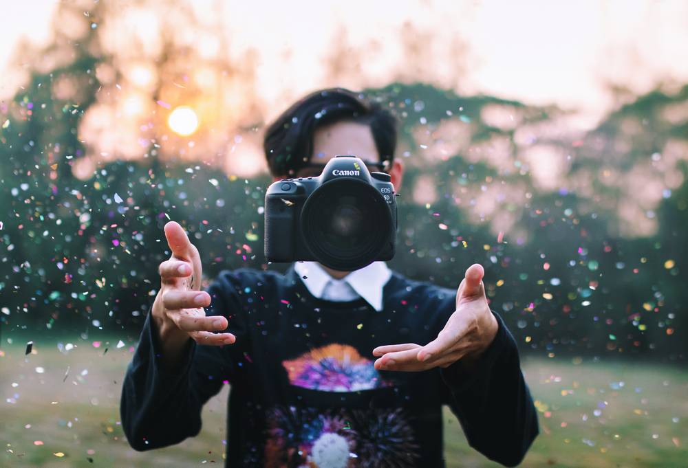 4 throwing-camera-amidst-confetti.jpg