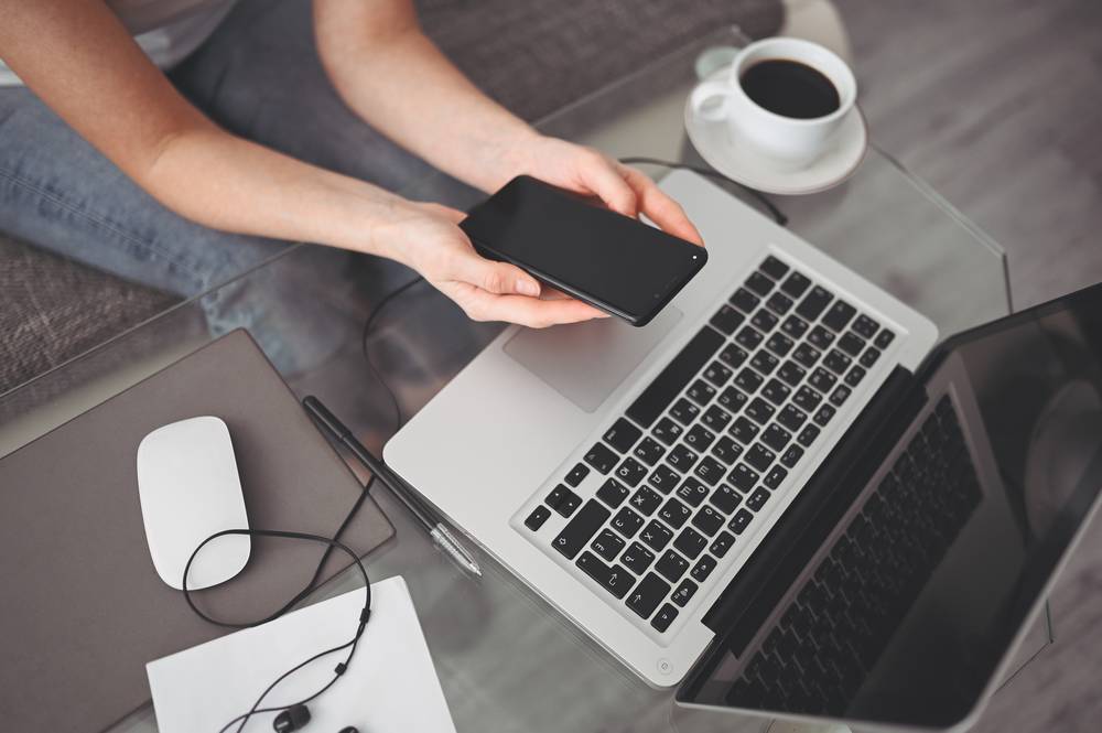 2 g-cell-phone-office-desk-working-from-home-using-smart-phone-notebook-comp.jpg