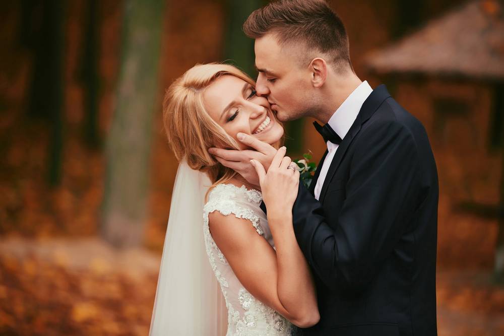 2 happy-young-married-couple-golden-yellow-fall-autumn-park.jpg