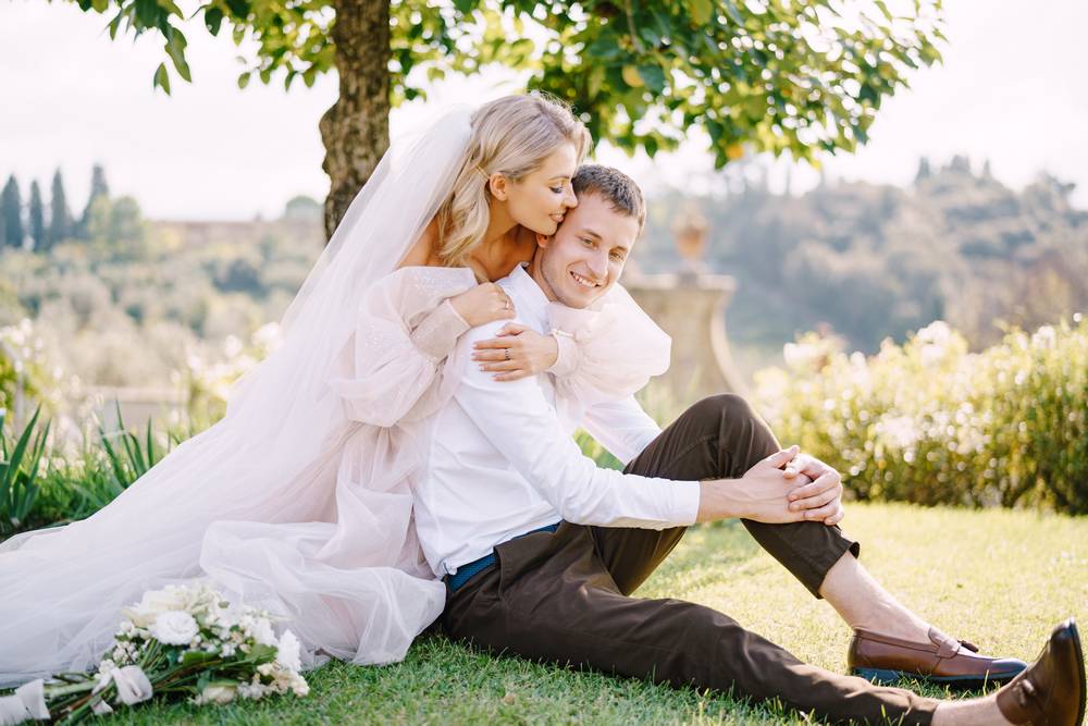 3 cheerful-couple-embracing-while-sitting-outdoors.jpg
